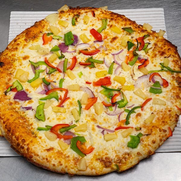 Moon Pizza's white pizza with pineapple, red onion, green, and red bell peppers.